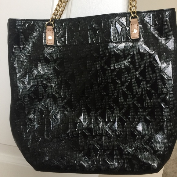 Michael Jors black and gold jet set bag