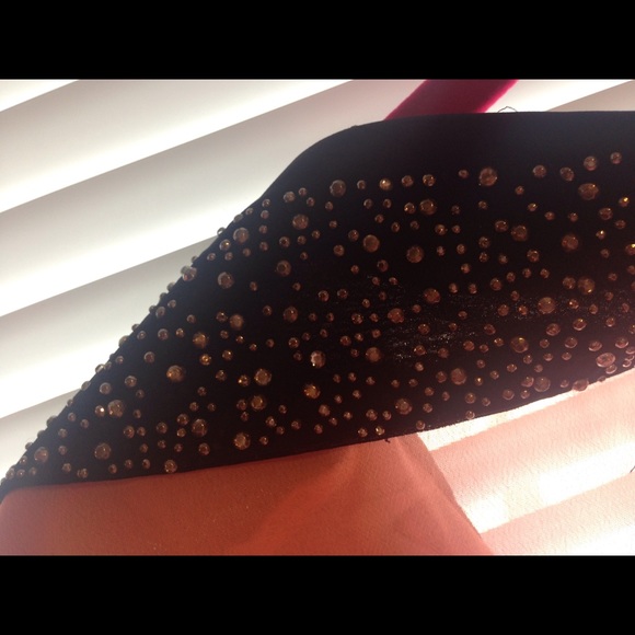 A Truth sheer top with a bling collar