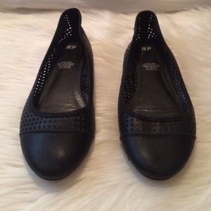 Black leather flats