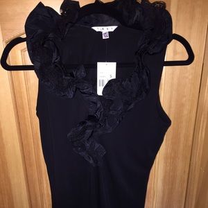 Black Cabi Knit top with lace embellishments.