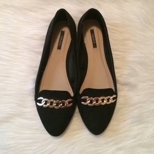 Black suede flats