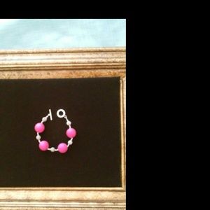 Hand made hot pink and sliver bead bracelet.
