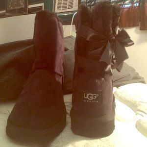 Short black bow UGG's . Never worn.