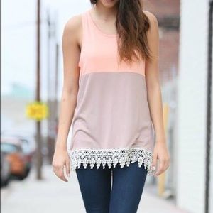 Tank with lace on the bottom.