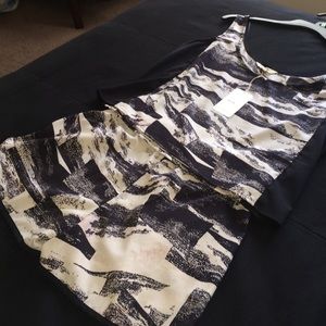 Two piece shirt and shorts outfit .