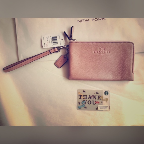 New pink Coach wristlet.
