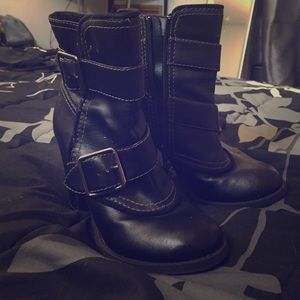 Black zip up high heel boots