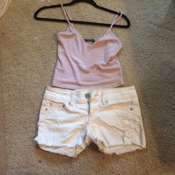 Gently distressed white AE jean shorts