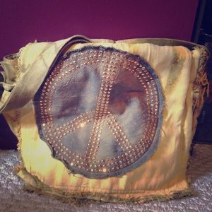 Yellow peace sign messenger bag