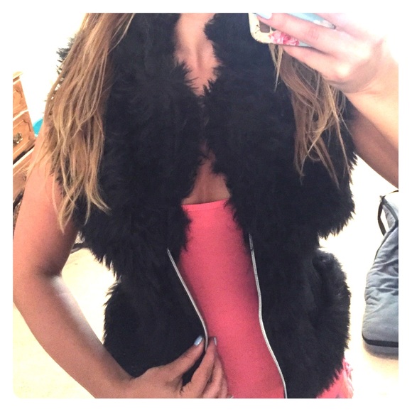 Black, fitted, stretchy, fuzzy vest