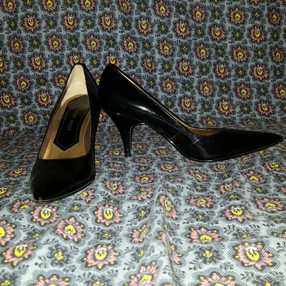 Pointy toe black patent leather heels.  NINE WEST