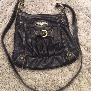 Kathy Van Zealand cross shoulder