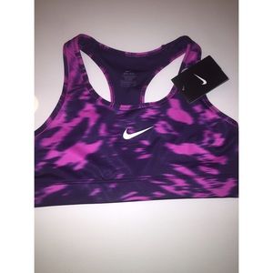 Purple and pink Nike sports bra