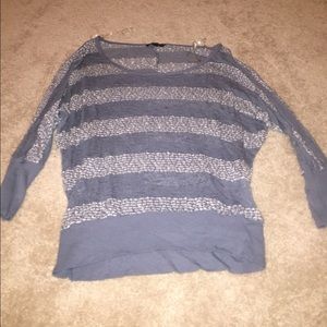 Faded blueish gray and white sweater.