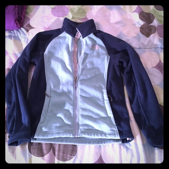 Dark and light blue north face jacket