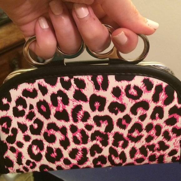Brass knuckle animal print clutch