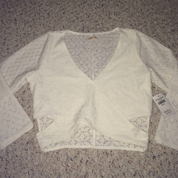 White long sleeved crop top with cutouts
