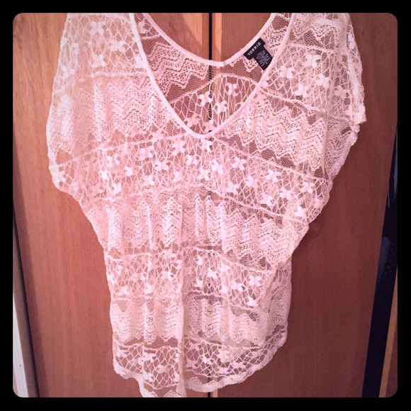 Cream-colored, lacy Torrid top