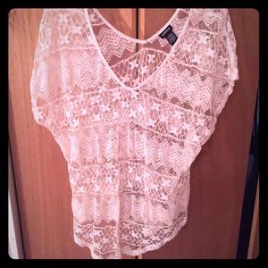 Cream-colored, lacy Torrid top