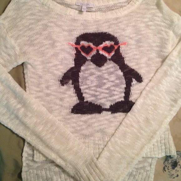 Delia's white sweater with penguin