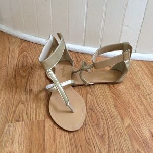 Gold Gladiator sandals.