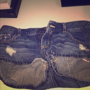 Short waisted distressed jeans