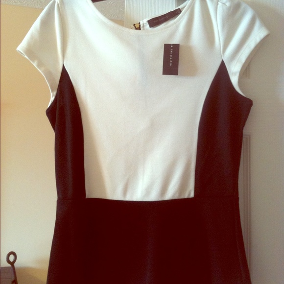 Peplum cream & black top