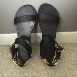 Black sandals with gold heel