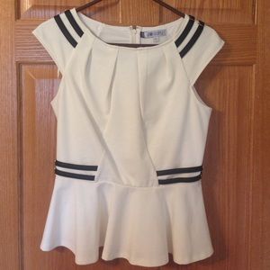 Ivory peplum top with faux leather accents