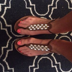 Dolce Vita t-strap sandals with metal detail.