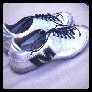 Gold Merrell lace up shoes.