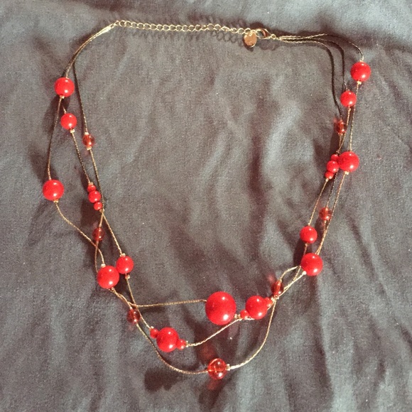 Three strand red beaded necklace
