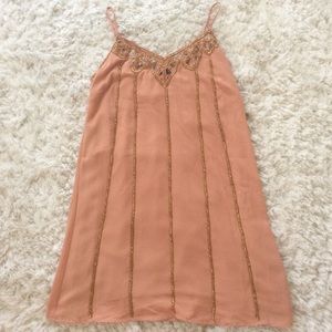 Peach sundress with gold beads