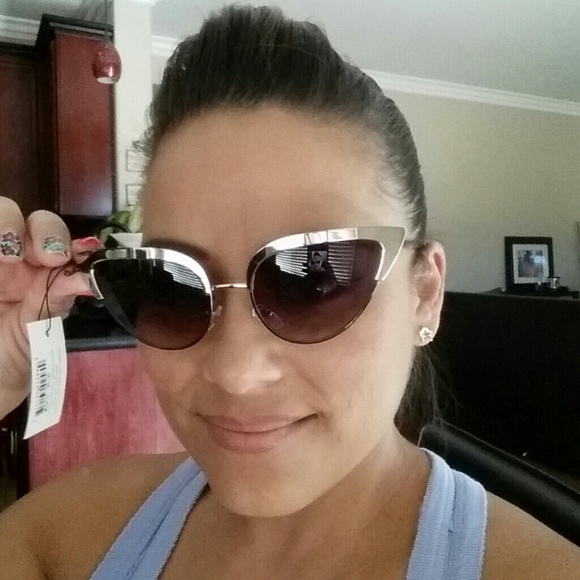 Gold metal rimmed cateye sunglasses
