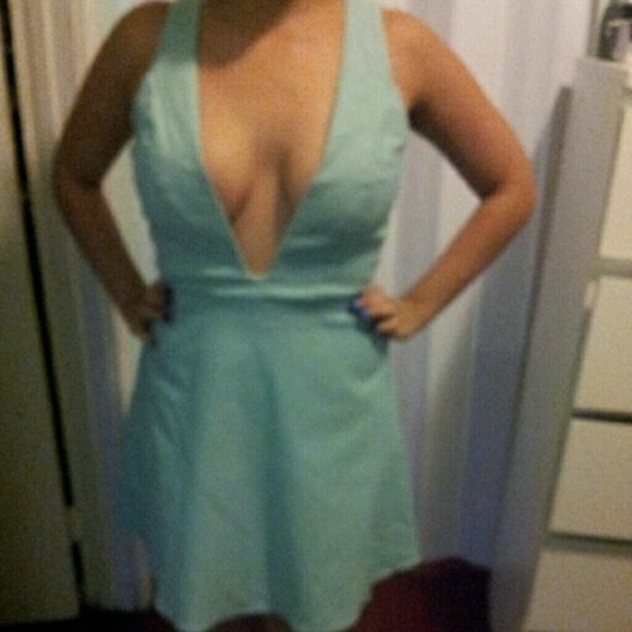 Aqua plunged dress and flared botrom