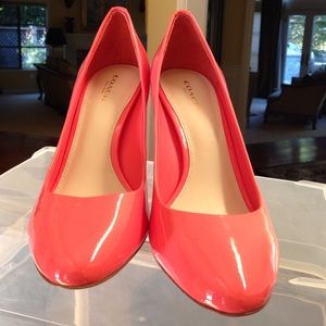 Coach coral patent leather pumps.