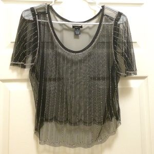 A black see through beaded top