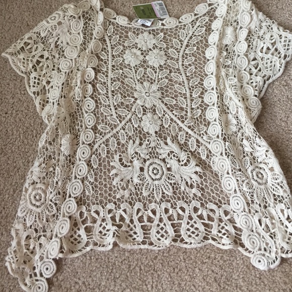 Crochet cardigan with flowers.