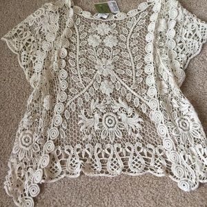 Crochet cardigan with flowers.