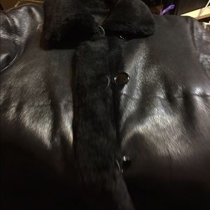 Stylish shiny leather fur coat