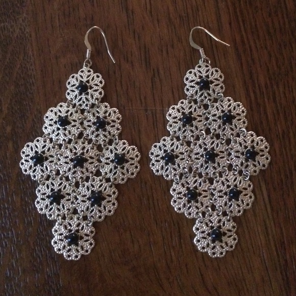 Black and gold chandelier earring.