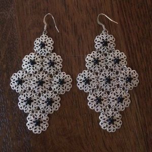 Black and gold chandelier earring.