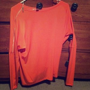 And orange zipper shirt
