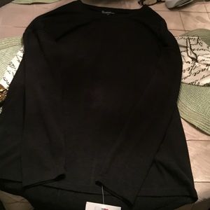 black sweater with shimmery elbow patches.