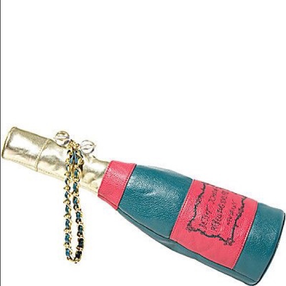 Sold:  Betsey Johnson champagne bag