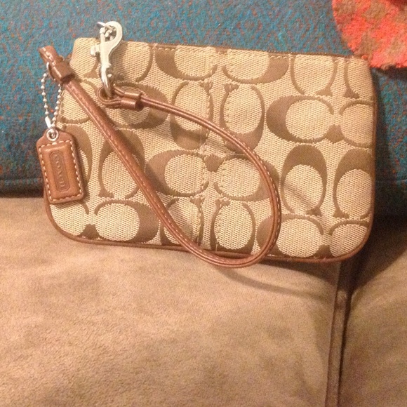 Coach Handbags - 💯COACH leather trim wristlet