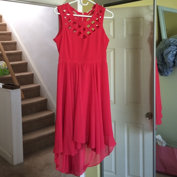 San Joy coral colored high low dress.