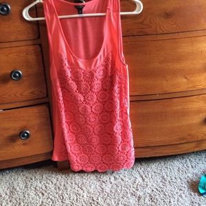 A laced back around pink shirt