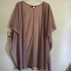 An oversized brownish beige kimono