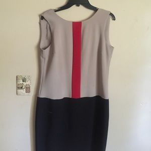 A beige, red, and black dress